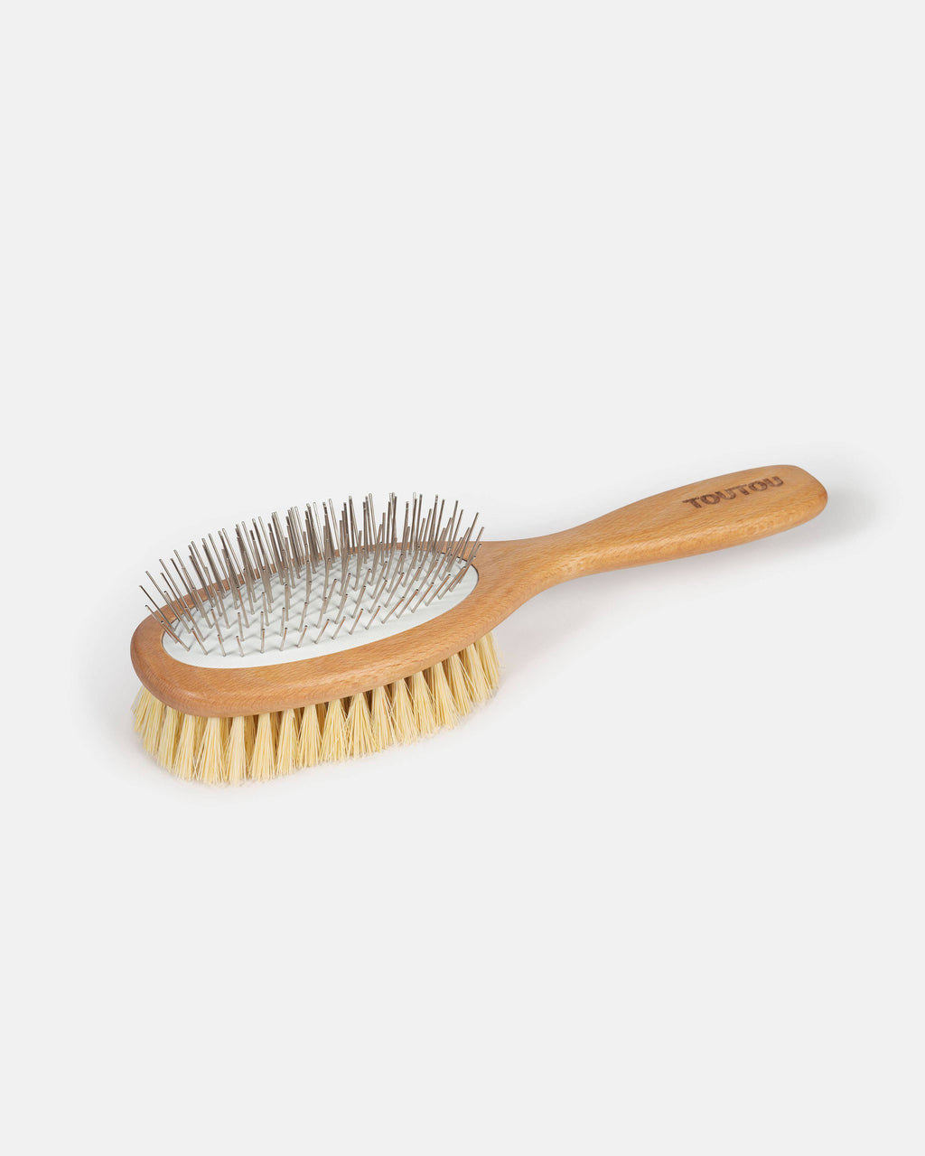 Wooden pet brush with metal bristles on a light gray background