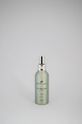 Fragrance bottle with a label on a gray background