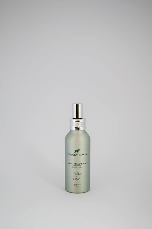 Fragrance bottle with a label on a gray background