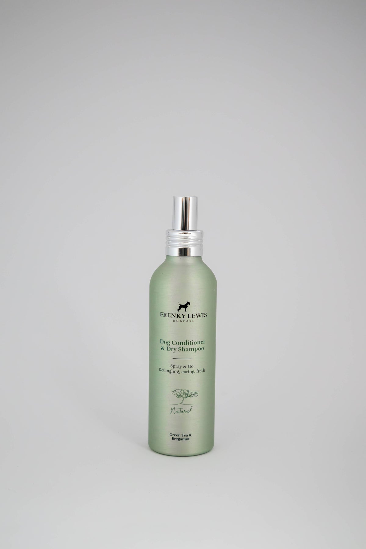 Green bottle of dog shampoo with silver cap on a gray background