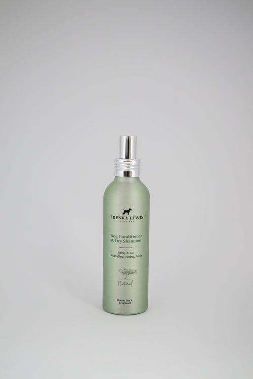 Green bottle of dog shampoo with silver cap on a gray background