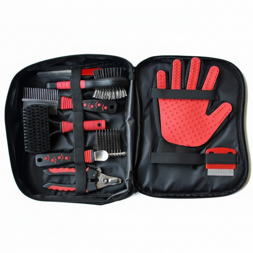 Grooming tool set with red and black tools in an open black case on a white background