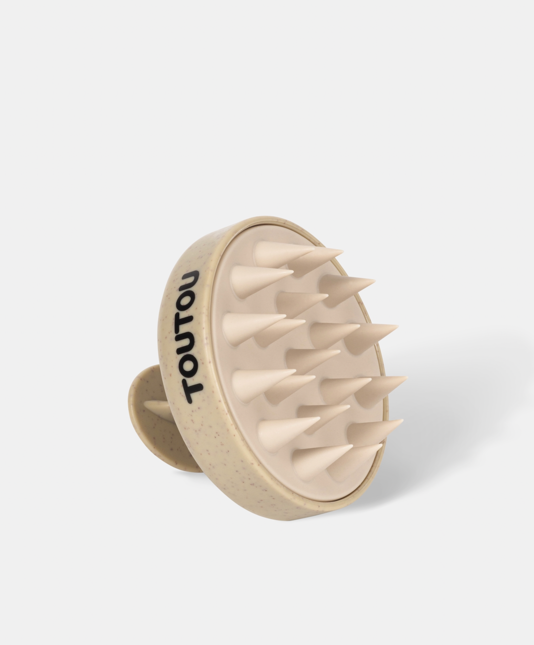 Beige scalp massager with 'TOUTOU' branding on a white background